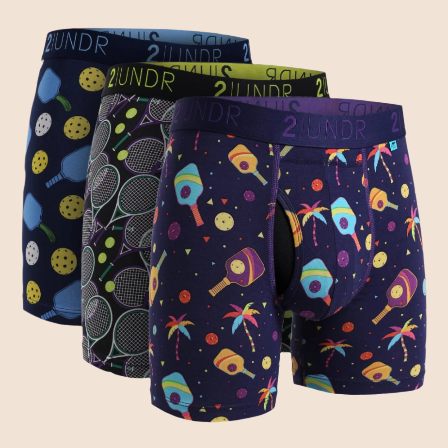 Three pairs of colorful men's underwear with various patterns on a white background